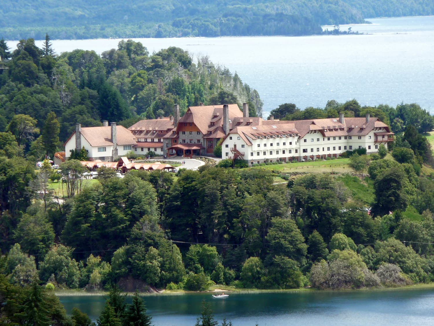 The Llao Llao Hotel between lakes and forest seen from the Punto Panorámico